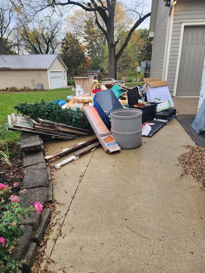 Dumpster being loaded with debris for Residential Dumpster Rental in Burlingame